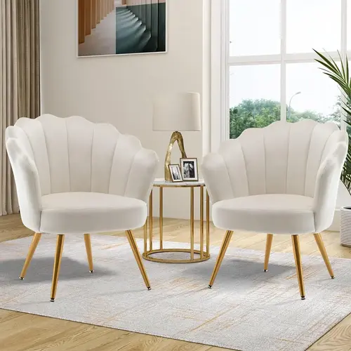 Two white scallop accent chairs